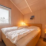 6 Personen In Direkter Seelage Mit Bootsteg Und Kanu Sowie Sauna, Whirlpool Und Kaminofen In Otterndorf