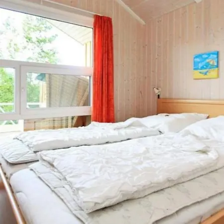 6 Personen In Direkter Seelage Mit Bootsteg Und Kanu Sowie Sauna, Whirlpool Und Kaminofen In Vakantiehuis Otterndorf