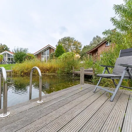 6 Personen In Direkter Seelage Mit Bootsteg Und Kanu Sowie Sauna, Whirlpool Und Kaminofen In Otterndorf